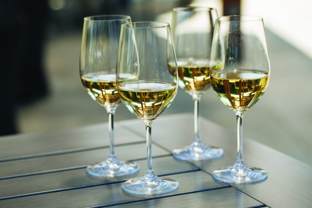 four glasses of white wine